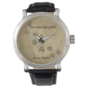 Montre Les chats laissent des empreintes de pattes dans n