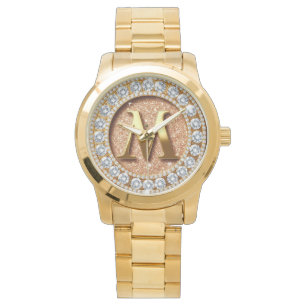 Montre Lettre M en monogramme sur fond pailleté or rose