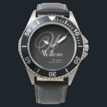 Montre Masculin Noir Visage Gris Blanc Monogramme Garçon<br><div class="desc">Offrez à vos garçons d'honneur un morceau d'élégance robuste avec cette montre classique à face noire. Caractérisée par un monogramme gris audacieux et une police blanche nette pour les noms et les dates, cette montre est conçue pour l'homme moderne qui apprécie une esthétique masculine et robuste. C'est un souvenir fonctionnel...</div>