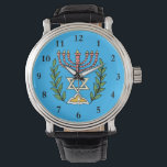 Montre Menorah Perse Et Magen David<br><div class="desc">Cette image a été adaptée à partir d'un carrelage juif perse antique et présente une menorah avec un Magen David (Étoile de David) encadré de branches d'olivier. Les imperfections de l'image originale peinte à la main ont été conservées.</div>