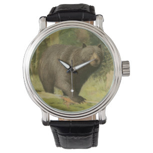 Montre Ours noir sur un tronc d'arbre