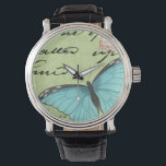Montre Papillon à ailes bleues sur carte postale Turquois<br><div class="desc">Cette carte postale turquoise porte un message de beauté. Un délicat papillon à ailes bleues repose sur la carte,  obscurcissant une partie du script qu'il contient. Cette impression de Vision Studio ferait un grand ajout à votre maison!</div>