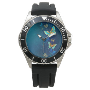 Montre Papillons d'or sur un Arrière - plan bleu
