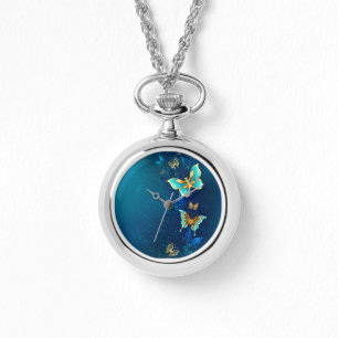 Montre Papillons d'or sur un Arrière - plan bleu