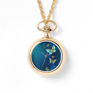 Montre Papillons d'or sur un Arrière - plan bleu