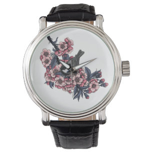 Montre Poulet sur une branche de cerise en fleurs