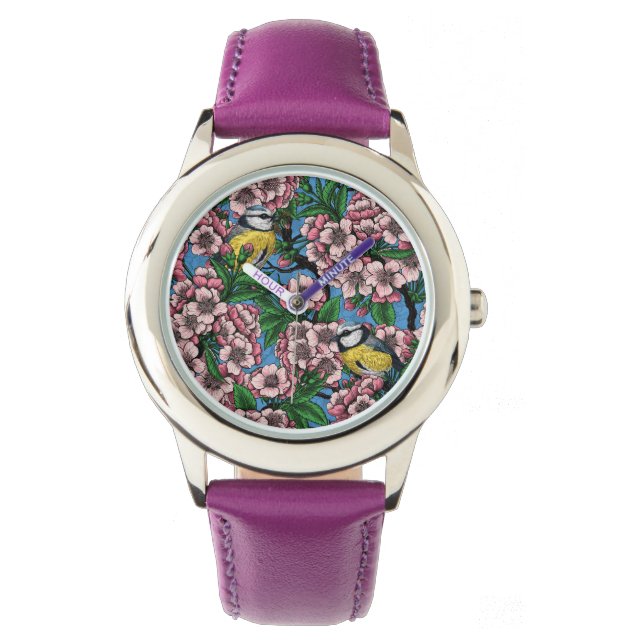 Montre Rameaux bleus dans le cerisier en fleurs sur le bl (devant)