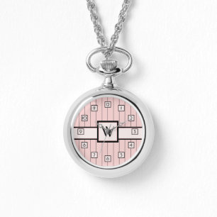Montre rose avec rayures noires
