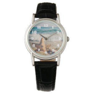 Montre Starfish sur une plage de sable Photo