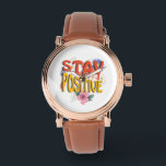 Montre Stay Positive – Floral Motivational<br><div class="desc">Brighten your day with this uplifting design! The bold phrase STAY POSITIVE is highlighted with vibrant colors and surrounded by cheerful floral elements,  making it a perfect reminder to embrace optimism and good vibes. Ideal for casual wear,  workouts,  or as a thoughtful gift to inspire positivity.</div>
