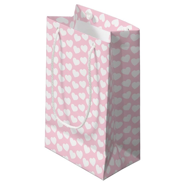 Motif blanc de coeur sur le petit sac rose-clair (Devant Angle)
