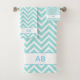 Motif élégant à chevrons et monogramme sur turquoi