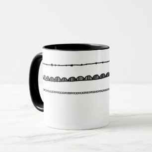 Motif noir et blanc de la tasse de motif assez