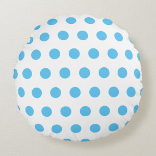 Motif pois bleu sur coussin rond blanc