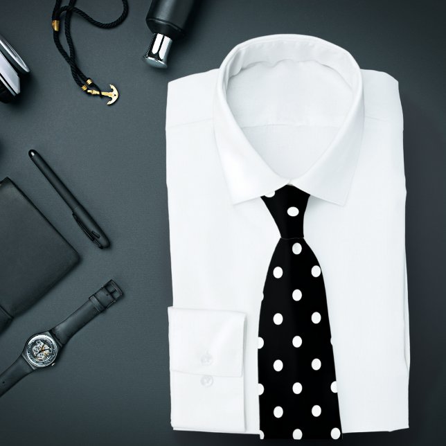 Motif Polka blanc classique sur Cravate noire (Black tie with white polka dots is featured on an assemblage of men's fashion accessories.)