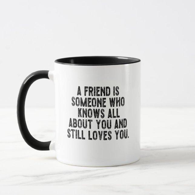 Mug A friend is someone who knows all about you and st (Gauche)