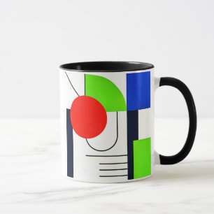 Mug aux designs géométriques en couleurs.