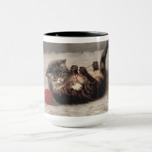 Mug Berceau de chat, un chat jouant avec une pelote de