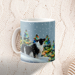 Mug Border Collie dans la forêt enneigée d'hiver arbre