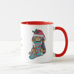 Mug chiot noir et brun mignon avec le bas de Noël