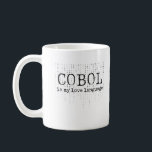 Mug Cobol est ma langue d'amour.b<br><div class="desc">Cobol est ma langue d'amour. Oui, aimez l'atmosphère vintage de l'expression CASQUETTE. Cette image montre un texte noir gras "COBOL is my love language" contre un arrière - plan de zéros et de zéros épars, suggérant un thème de programmation ou de codage. Le texte est stylisé avec un bord légèrement...</div>