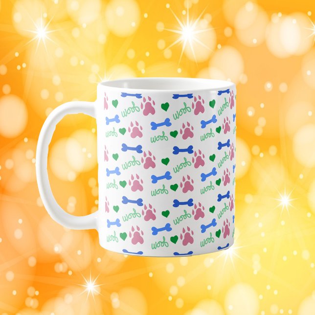Mug Cute Dog Paw Pattern Hearts, Bones Woof Pink Blue  (A mug with a pattern of pink dog paws, blue bones, green hearts and the word woof.)