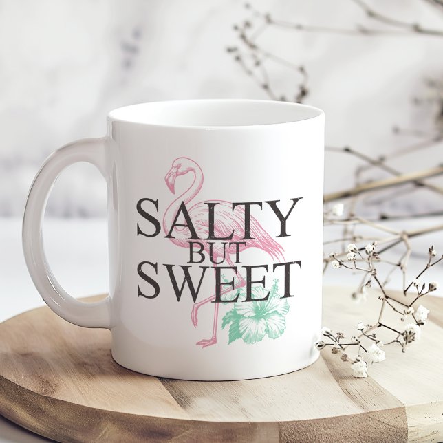 Mug Flamant rose "Salé mais doux" ("Salty but Sweet" Flamingo Coffee Mug on a sunny boho wooden kitchen table.)