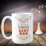 Mug Fleurs florales de la meilleure maman du monde<br><div class="desc">Meilleure maman Fleurs Floral Fête des Mères Mug du monde. Fleurs dessinées à la main dans de belles couleurs printanières. Mug pour une mère pour la fête des mères,  un anniversaire ou Noël. Tu peux changer maman en maman,  maman, ... </div>