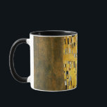 Mug Gustav Klimt The Kiss Vintage<br><div class="desc">Gustav Klimt Le Kiss Vintage Art Nouveau Peinture Le Kiss (En allemand : Der Kuss) a été peint par le peintre symboliste autrichien Gustav Klimt entre 1907 et 1908, le point culminant de sa période d'or, lorsqu'il peignit un certain nombre d'oeuvres dans un style doré similaire. Le tableau est largement...</div>