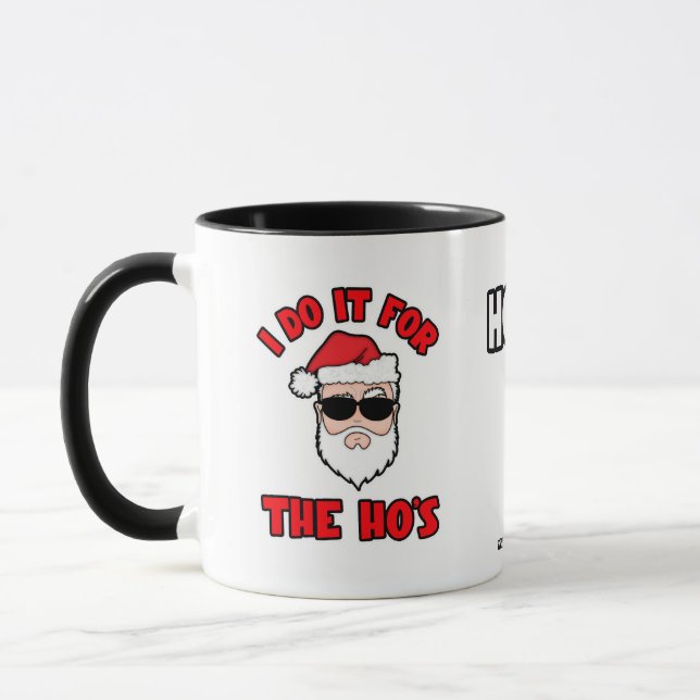 Mug JE LE FAIS POUR LES POUPÉES Santa Screwball Graphi (Gauche)