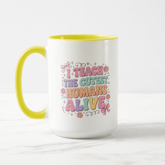 Mug J'enseigne aux humains les plus mignons qui soient (Gauche)