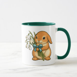 Mug Lapin mignon avec bouquet et ruban de soie vert.