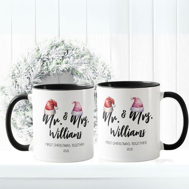 Mug M. et Mme First Christmas ensemble (Mr and Mrs Name First Christmas together, year. Mr with a red Santa hat, Mrs with a pink Santa hat)