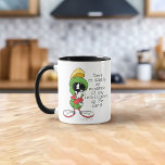 Mug MARVIN LE MARTIEN ™ Réflexion<br><div class="desc">Commencez votre journée avec un peu d'humour intergalactique en utilisant cette tasse « Réfléchissant » de Marvin le Martien ! Avec le personnage emblématique de Looney Tunes dans une pose pensive, ce design capture parfaitement le charme particulier et l'esprit cosmique de Marvin. Fabriquée à partir de matériaux durables avec une...</div>