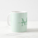 Mug Monogramme de nom à rayure verte moderne<br><div class="desc">Commencez votre matinée avec style avec cette tasse à café verte rayée personnalisée, conçue pour apporter un charme intemporel à chaque gorgée. Avec un fond rayé vert clair et blanc, cette tasse élégante est personnalisée avec votre initiale de monogramme et votre nom complet dans une police de caractères script gracieuse,...</div>