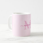 Mug Monogramme de nom à rayures roses modernes<br><div class="desc">Commencez votre matinée avec style avec cette tasse à café rose rayée personnalisée, conçue pour apporter un charme intemporel à chaque gorgée. Avec un fond rayé rose pâle et blanc, cette tasse élégante est personnalisée avec votre initiale de monogramme et votre nom complet dans une police de caractères script gracieuse,...</div>