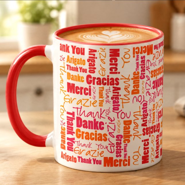 Mug Rouge Orange Merci Multilingue (Red and orange thank you word cloud designed 11 ounce coffee filled ceramic mug on table.)