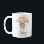 Mug Simple Harry Potter - Dobby Baby Shower<br><div class="desc">Announce your pregnancy or use it proudly at the baby shower with this adorable personalized mug design! Featuring the sweet, Dobby-inspired character surrounded by twinkling pastel stars, this design captures the gentle magic of expecting. The soft, charming artwork pairs perfectly with the elegant custom name script, creating a whimsical and...</div>