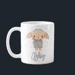Mug Simple Harry Potter - Dobby Baby Shower<br><div class="desc">Announce your pregnancy or use it proudly at the baby shower with this adorable personalized mug design! Featuring the sweet, Dobby-inspired character surrounded by twinkling pastel stars, this design captures the gentle magic of expecting. The soft, charming artwork pairs perfectly with the elegant custom name script, creating a whimsical and...</div>