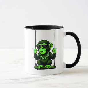Mug Singe cartoon vert sur une balançoire.