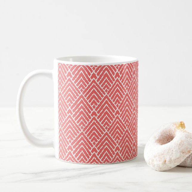 Mug un arrière - plan rouge et blanc avec un motif (Avec donut)