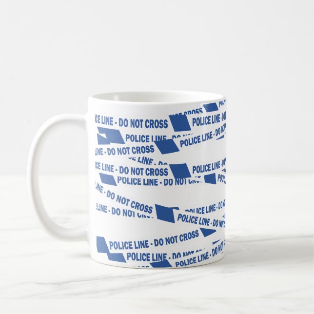 Mug Un officier de police britannique ne transcende pa (Gauche)