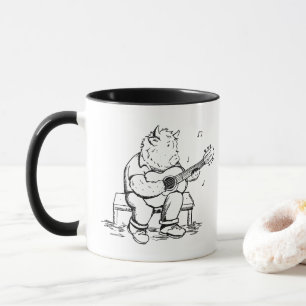 Mug Vache des Highlands jouant de la guitare acoustiqu