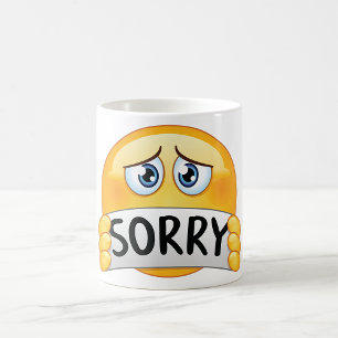 Mug Visage d'Emoji Triste et Désolé Tenant un Panneau
