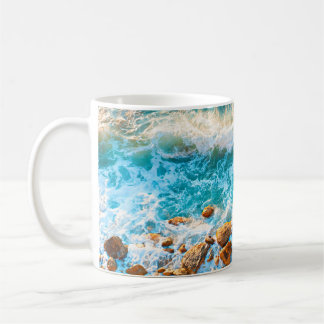 Mug Waves on a rocky beach at sunset. Aerial viewbeach