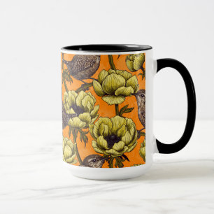 Mug Wrens dans le jardin d'anémones jaunes