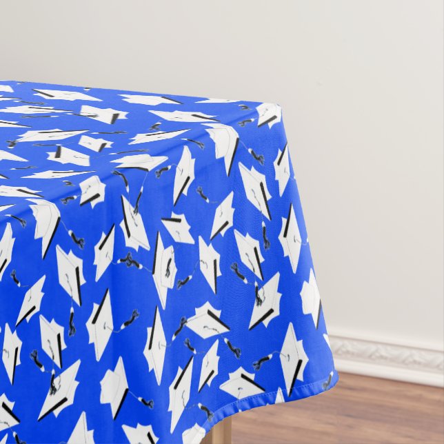 Nappe White Graduation Caps on Bright Blue (In Situ)