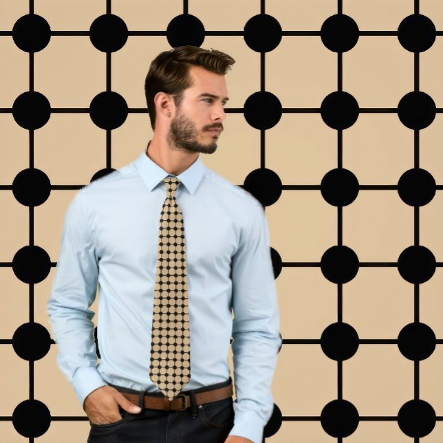 Noir sur les points tans et cravate de grille (Man wears a necktie with a black grid pattern on tan.
)