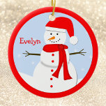 Nom Personnalisé Noël Snowman Ornement<br><div class="desc">Ce nom personnalisé bonhomme de neige de Noël est orné d'un adorable petit bonhomme de neige portant un chapeau de Père Noël rouge, un muffleur rouge et des boutons rouges pendant une journée d'hiver avec de la neige tombant dans l'arrière - plan. La scène du bonhomme de neige a une...</div>