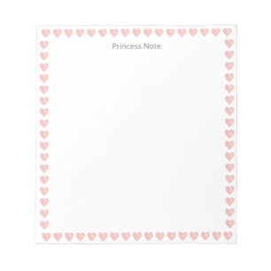 Note de princesse & cœurs roses sur un bloc-notes 